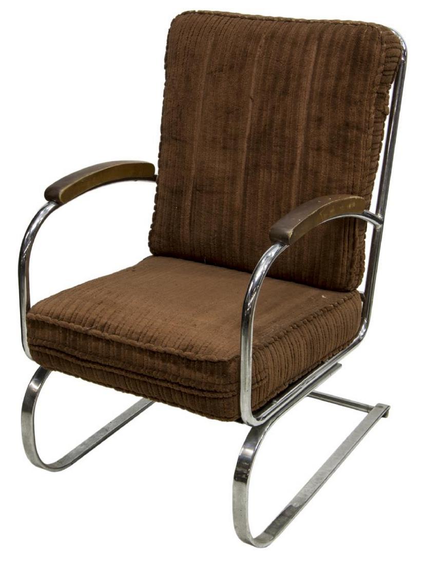 GILBERT ROHDE (ATTRIB) ART DECO CANTILEVER CHAIR: Art Deco armchair, c. 1930s, design attributed to Gilbert Rohde (United States, 1894-1944), in brown upholstery, with wooden armrests, on a tubular chrome finish cantilever frame, some wear to upholst
