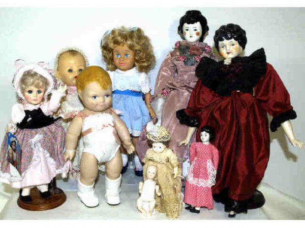 GROUP OF CHINA HEAD AND VINTAGE DOLLS: (lot of 9) Three China head dolls with cloth bodies, each attired in the Victorian style, 19" (largest), 2.75lbs total; together with a lot of six assorted dolls including Effanbee, Daisy Kingdom, 195