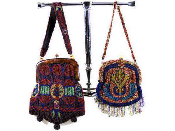 TWO VINTAGE ART DECO BEADED JEWEL TONE PURSES: (lot of 2) Vintage Art Deco beaded purses with beaded handles, one having a mottled bakelite frame, both beaded in rich jewel tones with detailed geometric and foliate design, one lacking liner, both