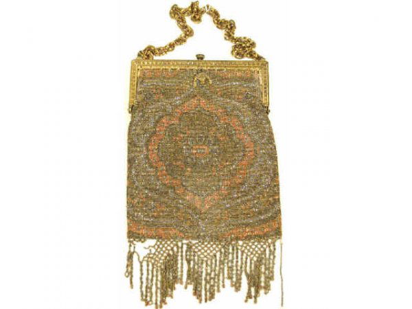 ANTIQUE FRENCH STEEL CUT GILT FRAME BEADED PURSE: French purse ornately beaded with multi color steel cut beads in peach, gold, and silver, supported on a detailed gilt metal frame, braided fringe accents the bottom, silk lined, early 20th century, M