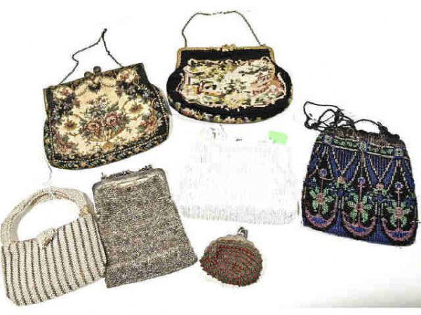 COLLECTION OF VINTAGE NEEDLEPOINT & BEADED PURSES: (lot of 7) Collection of vintage needlepoint and beaded purses including: Walborg, French needlepoint bag in black and floral cream, on a gilt metal frame, 6.5"l; floral motif needlepoint bag on an or