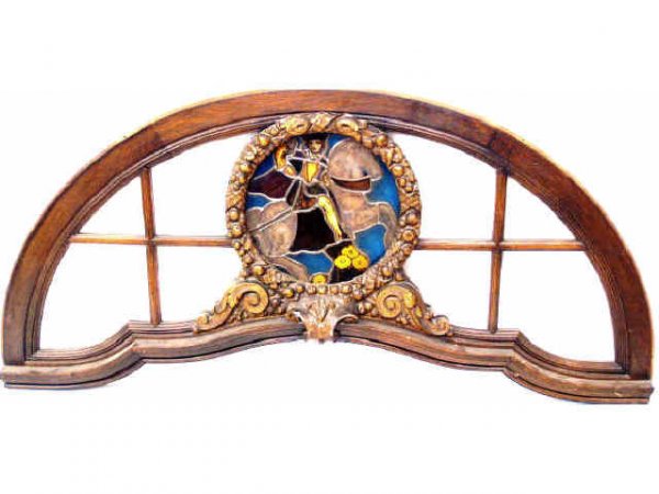 SPAIN ARCHITECTURAL STAINED GLASS DOORS & TRANSOM: Impressive set of Northern Spain architectural entry doors and transom, circa 1920, the oak frame mullioned doors having sixteen beveled panes each, surmounted by an arched transom of conforming desig