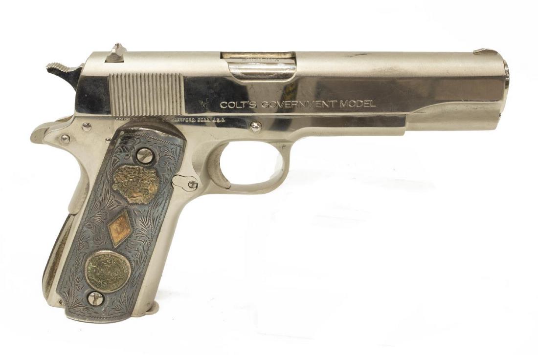 COLT MODEL MKIV/SERIES 70 NICKEL .45 CAL PISTOL: Colt Government Model, MK IV, Series 70 pistol, .45 caliber, 5" barrel, chrome frame, Colt magazine, engraved metal Mexico grips with Mayan figure and symbols, mfg. 1977, some finish scratches, SN 215
