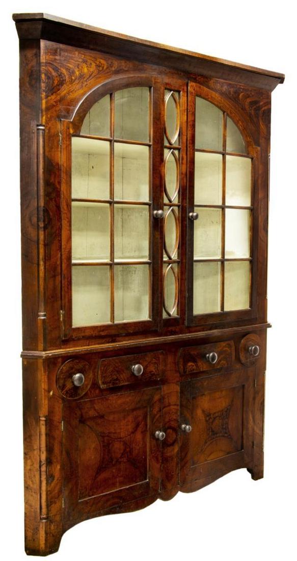 FINE AMERICAN BURL PAINTED CORNER CABINET: Early American corner cabinet, early 19th c, having the original painted burl finish, the upper cabinet with a protruding cornice over two glazed pane doors opening to painted shelves with slots and p