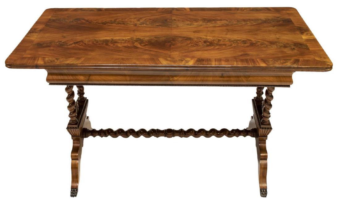 ENGLISH REGENCY STYLE FLAME MAHOGANY WRITING TABLE: English Regency style writing table, late 19th c., rectangular top with matched flame mahogany veneers, single ogee drawer in frieze, rising on stretcher-joined spiral supports, gadrooned base ending 