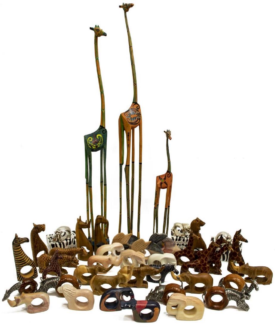 LARGE LOT AFRICA WILDLIFE NAPKIN RINGS & GIRAFFES: (lot) Large collection of African figural napkin rings, fashioned from stone, wood and metal, various wildlife including fish, cheetah, hippo, giraffes and more; together with (3) carved and polychrom
