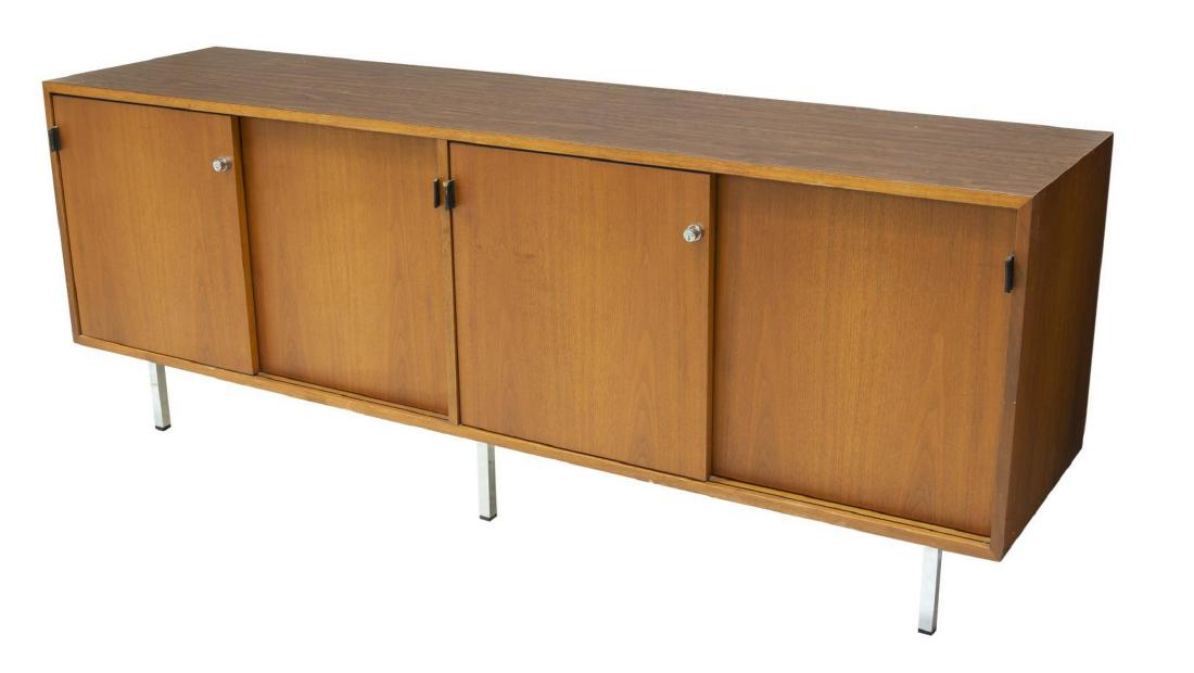 FLORENCE KNOLL FOR KNOLL INTERNATIONAL CREDENZA: Mid-century modern style credenza, c. 1981, designed by Florence Knoll (United States, 1917-2019) for Knoll International, rectangular case fitted with four sliding doors with leather tab pulls, openi
