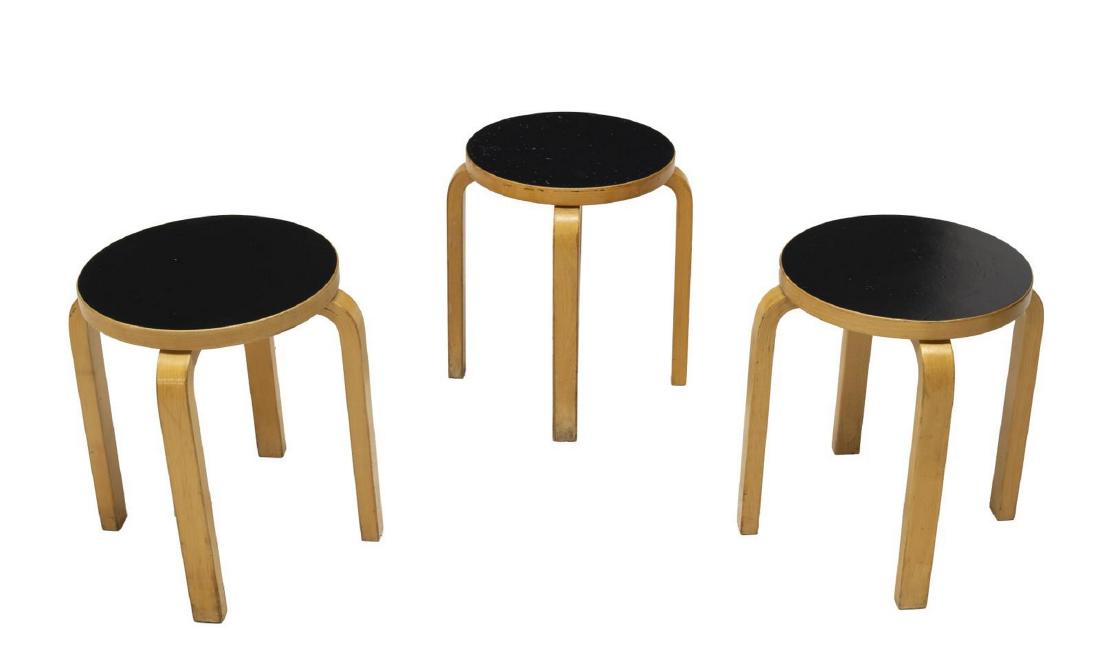(3) ALVAR AALTO ICF MODEL 60 BIRCH STACKING STOOLS: (lot of 3) Model 60 stacking stools, designed by Alvar Aalto (Finland, 1898-1976) for ICF, circular black tops, laminated birch frames, on three bentwood legs, approx 17.25"h, 13.5"diam Start Price: $