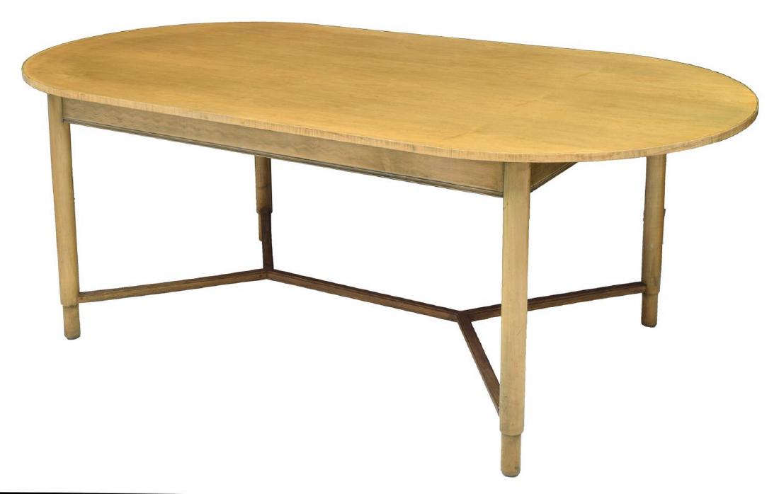 MID-CENTURY MODERN BIRCH FINISH OVAL DINING TABLE: Mid-century modern oval dining table, c. 1950's, with birch finish, rising on double Y-stretcher turned legs, on cylinder feet, approx 30.25"h, 80.25"w, 42"d Start Price: $100.00