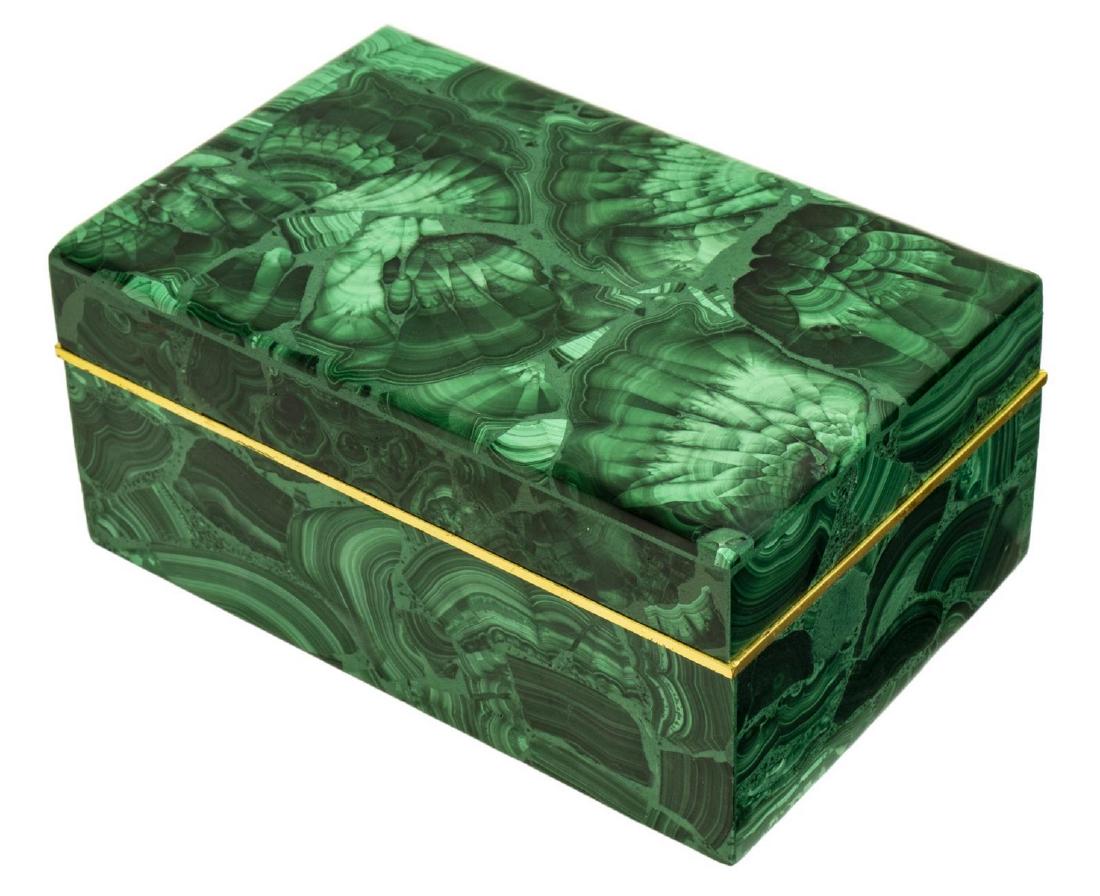 GREEN MALACHITE RECTANGULAR DESK OR TABLE BOX: Malachite desk or table box, 20th c., rectangular form, lift top, gilt metal border, unlined interior, approx 2.5"h, 5.75"w, 3.75"d, 1.75lbs Start Price: $100.00