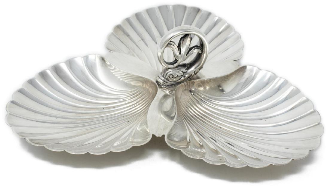 TIFFANY & CO. STERLING SILVER DIVIDED SHELL DISH: Tiffany & Co. Makers sterling silver (925) divided serving dish, c.1939-1940, with dolphin handle, over three scallop shell-form bowls, pattern number 22786, approx 3.5"h, 9"w, 14.16ozt Start Price: $