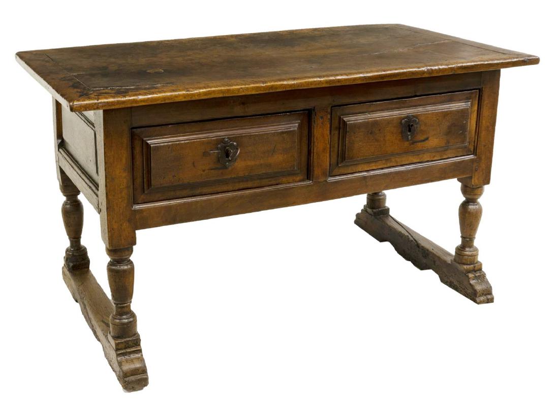 SPANISH SINGLE BOARD WALNUT WORK TABLE: Spanish walnut work table, 18th c., having a framed single board top, over two drawers, rising on turned legs joined by stretchers, having patched repairs and splits to the top, approx 32.5"h, 57"w, 2