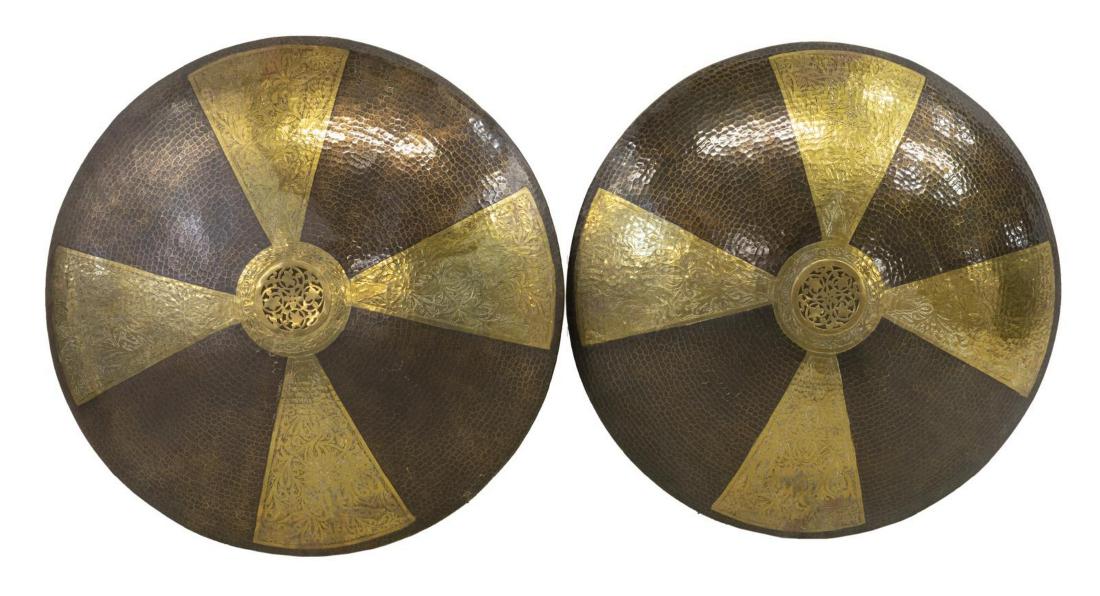 (2) MOROCCAN HAMMERED METAL WALL SCONCES, 29" DIAM: (lot of 2) Large metal wall sconces, 20th c., Morocco, having alternating foliated and hammered panels, open work foliates at center, concealing four lights to the back, in need of wiring, approx 29.2