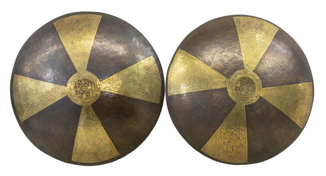 (2) MOROCCAN HAMMERED METAL WALL SCONCES, 29" DIAM: (lot of 2) Large metal wall sconces, 20th c., Morocco, having alternating foliated and hammered panels, open work foliates at center, concealing four lights to the back, in need of wiring, approx 29.2