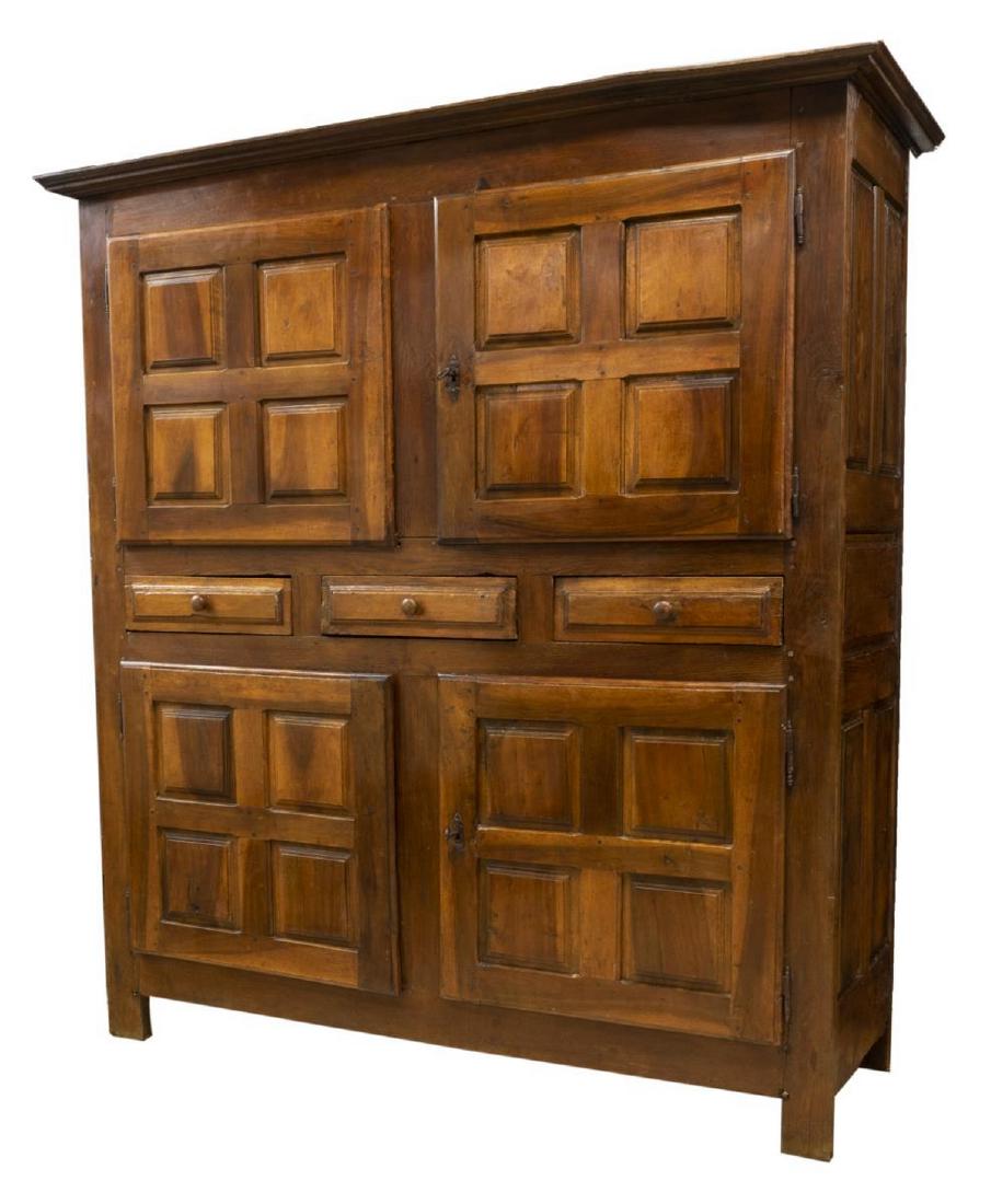 LARGE FRENCH PROVINCIAL OAK CUPBOARD, 18TH C.: Large French Provincial oak cupboard, 18th c., having cornice top, case fitted with two sets of paneled double doors on exterior hinges, centering three drawers, paneled sides, rising on plain legs ex