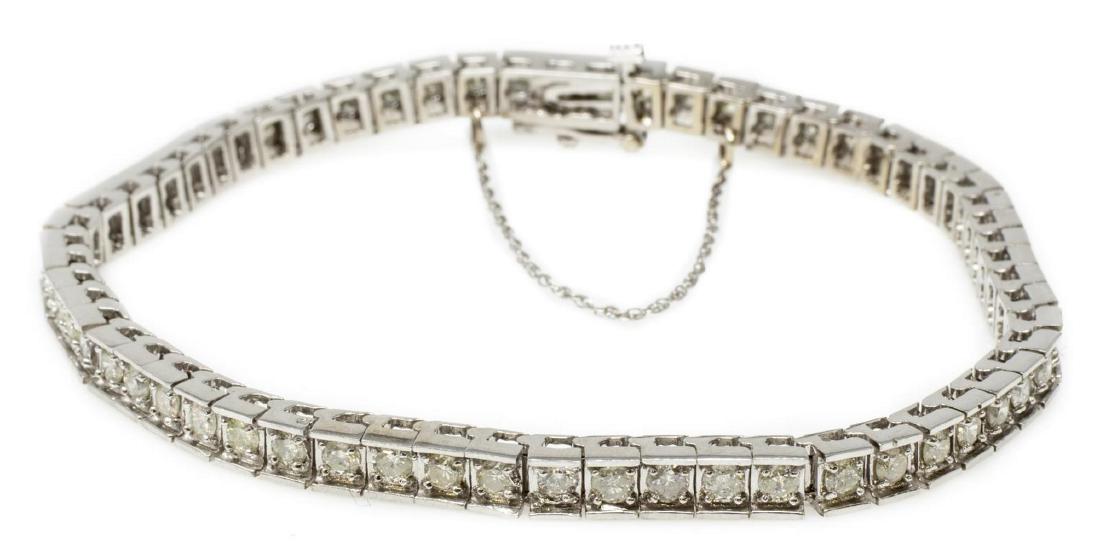 ESTATE 14KT WHITE GOLD & 8.75CTTW TENNIS BRACELET: Estate 14kt white gold and diamond tennis bracelet, comprising: (60) round diamonds, approx 8.75cttw, average clarity: SI2-I1, average color: I-J-K; with safety chain, approx 7.5"l, 19.5 grams (inclus