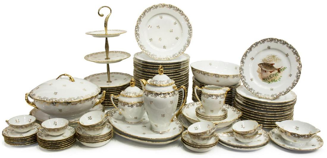 (105) FRENCH LIMOGES PARCEL GILT DINNER SERVICE: (lot of 105) French Limoges parcel gilt porcelain dinner service, 20th c., having a foliated netting pattern, including: (23) dinner plates, 10.25"diam, (11) salad plates, 8.5"diam, (12) soup bowls, 9