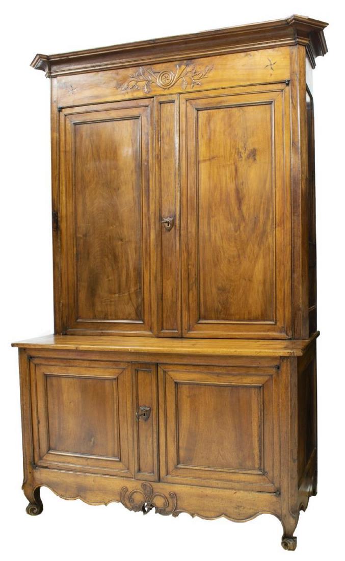 FRENCH LOUIS XV WALNUT BUFFET A DEUX CORPS: French Louis XV walnut buffet a deux corps, late 18th c., the stepped cornice above carved foliate relief and star parquetry, dual cabinet doors opening to interior shelving, cabinet base with interio