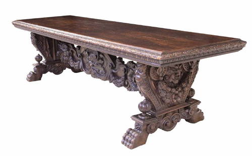 MONUMENTAL ITALIAN CARVED WALNUT REFECTORY TABLE: Monumental Italian walnut refectory table, late 18th c., the top having three panels and running ornamentation of alternating urns and griffins to the border, the shaped trestle base decorated with gr