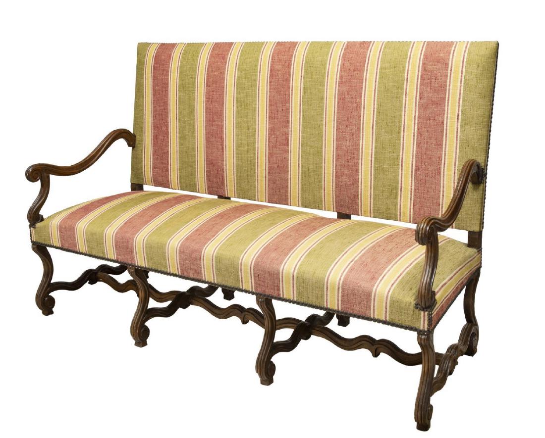 FRENCH LOUIS XIV STYLE UPHOLSTERED SETTEE SOFA: French Louis XIV style settee, late 19th c., upholstered straight back over bench seat, in striped textile, volute armrests and supports, joined by H stretcher, approx 48"h, 75.25"w, 25.5"d Start Pric