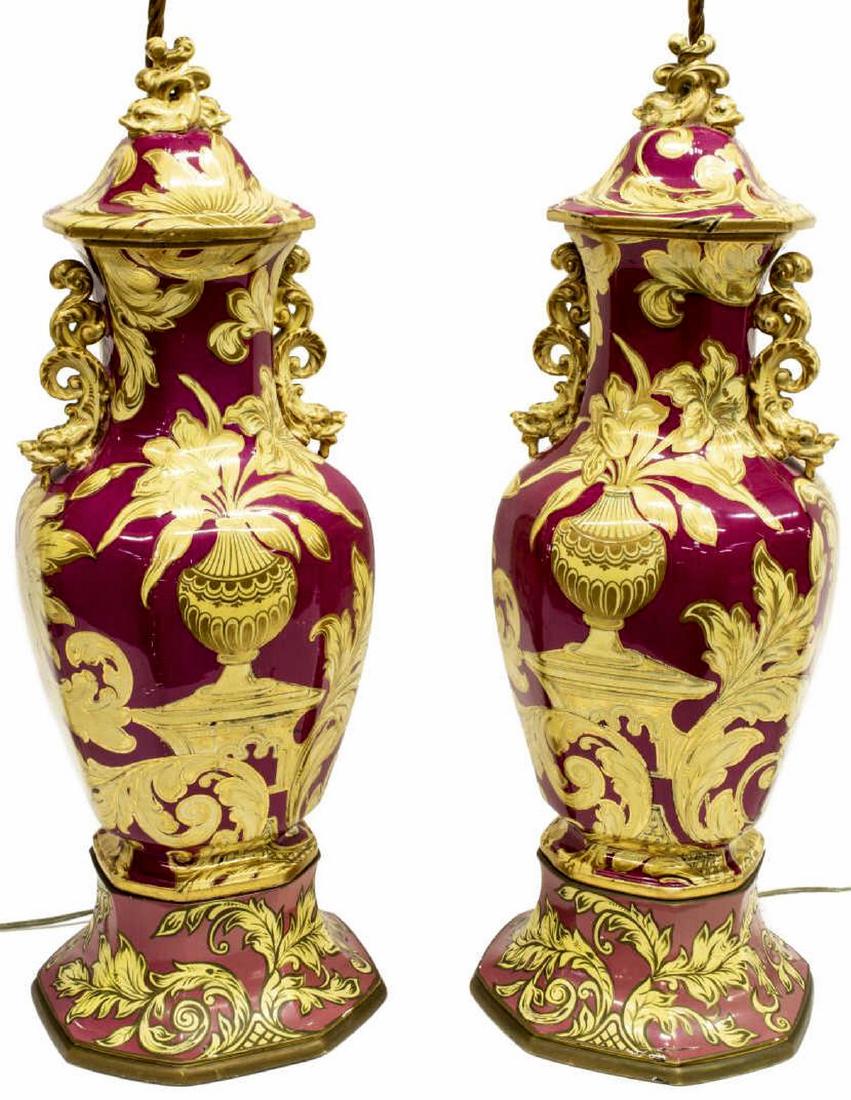 (2) PORCELAIN TABLE LAMP URNS W/ ACANTHUS PATTERN: (Pair) Lidded porcelain urns, now fashioned as table lamps, each with crystal finial to harp, the body with gilt dragon form handles and parcel gilt acanthus pattern, rising on a later base, each appr