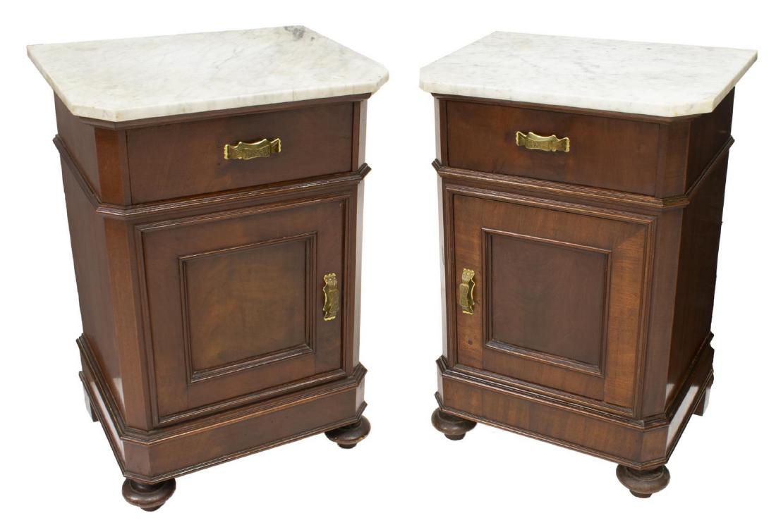 (2) LOUIS PHILIPPE MARBLE-TOP MAHOGANY NIGHTSTANDS: (pair) Louis Philippe period mahogany bedside cabinets, 19th c., the marble top having canted edges, over case fitted with a single drawer over cabinet door, opening to interior shelving, rising on bl