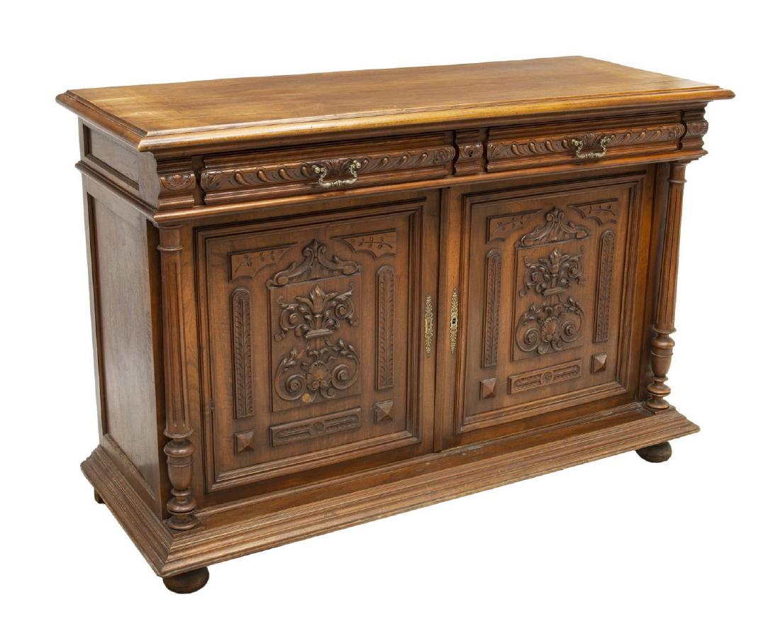 FRENCH HENRI II STYLE CARVED OAK SIDEBOARD SERVER: French Henri II style oak sideboard, late 19th c., accented by running ornamentation, shell and foliate carving, having two drawers above double-door cabinet fitted with single shelf, flanked by flute