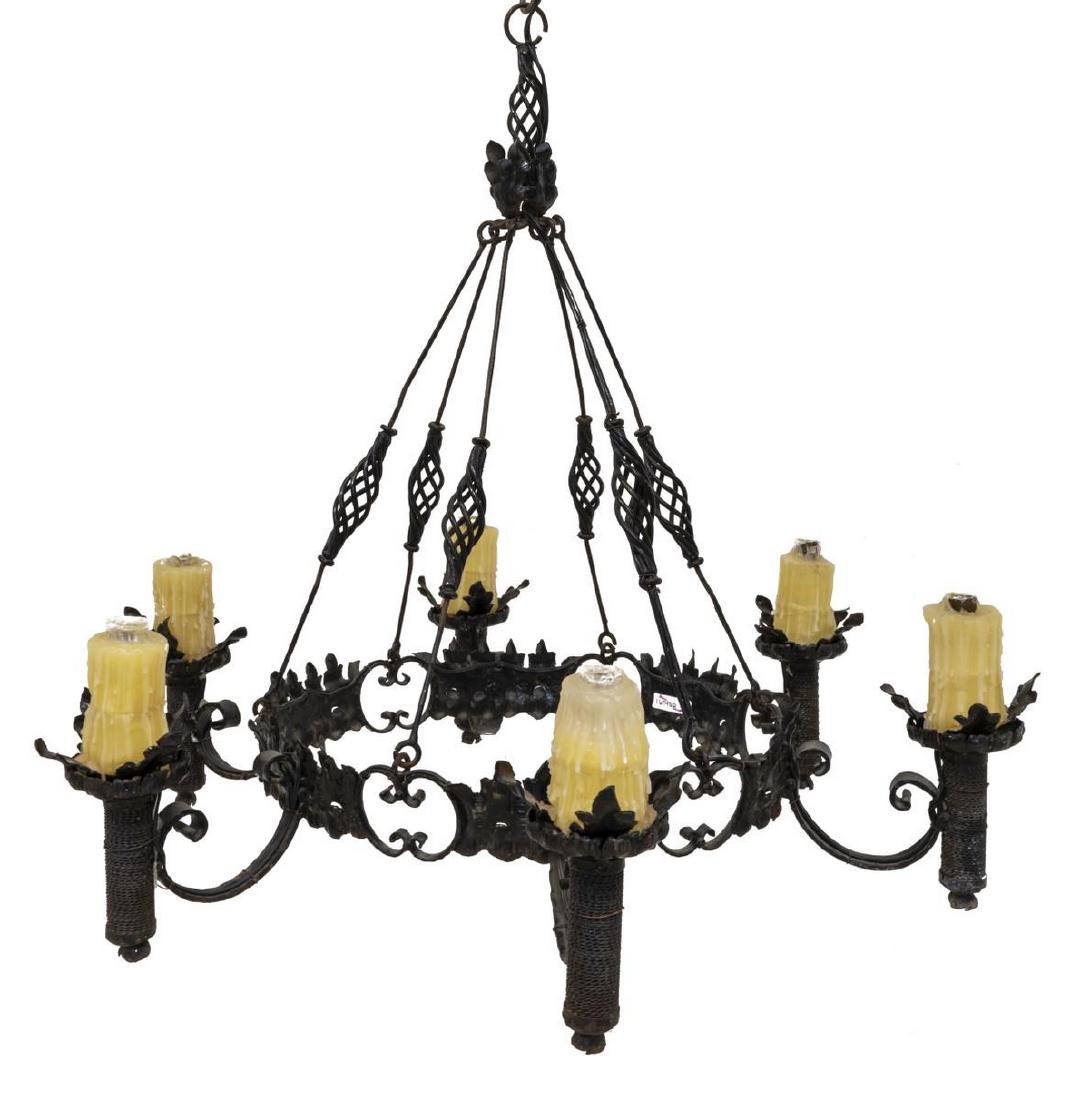 GOTHIC STYLE WROUGHT IRON SIX-LIGHT CHANDELIER: Gothic style wrought iron six-light chandelier, 20th c., having six lights encased in candle covers, accented by foliate motifs, approx 26"h, 29.5"diam Start Price: $200.00