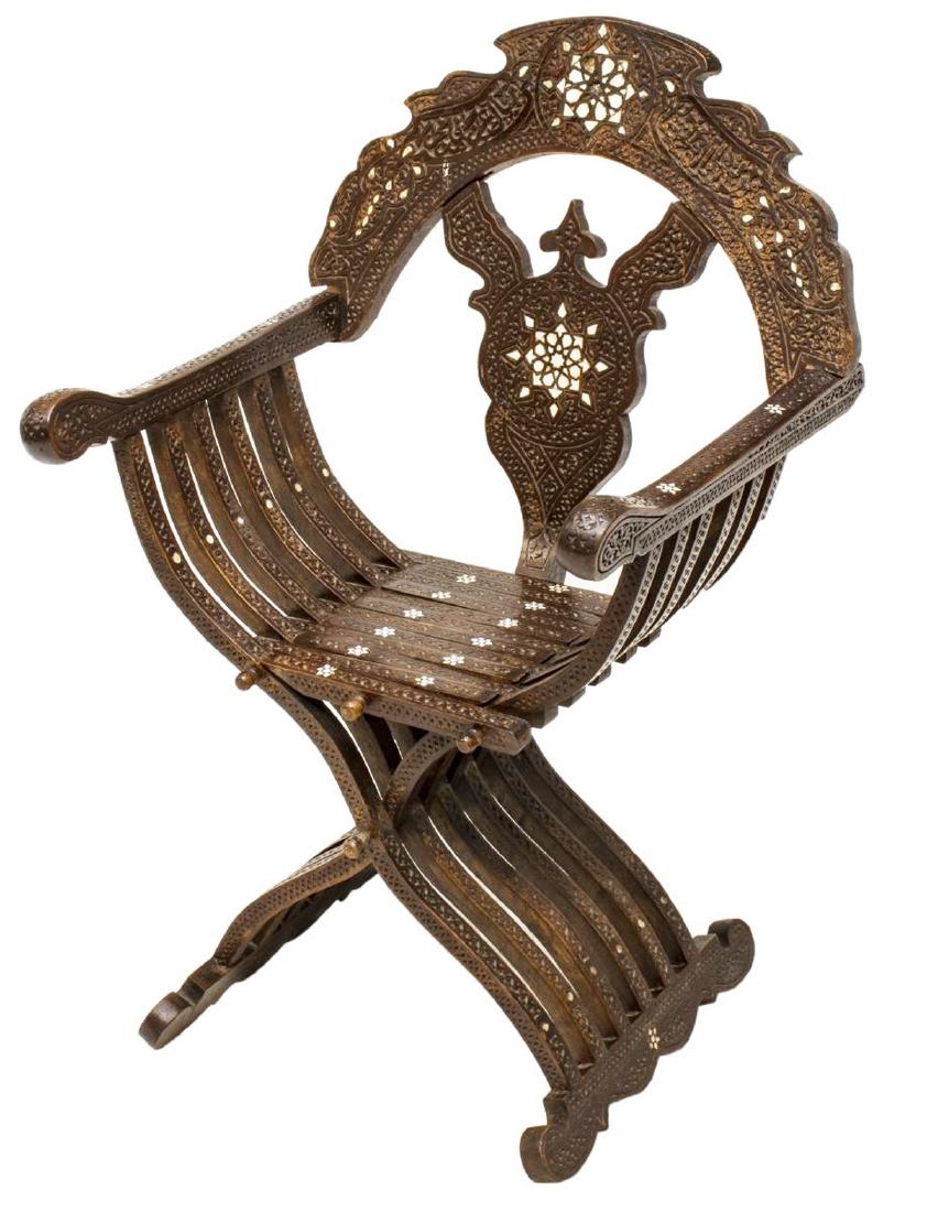 SYRIAN SAVONAROLA MOTHER OF PEARL INLAID ARM CHAIR: Syrian Savonarola style arm chair, 20th c., having a slatted folding frame, mother of pearl and scrollwork elements, some shell inlay missing to the backrest, approx 40"h, 25"w, 23"d Start Price: $100