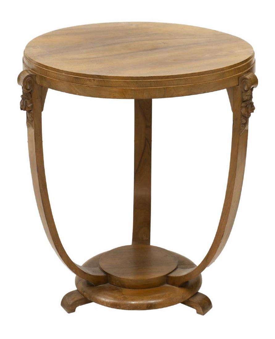 FRENCH ART DECO WALNUT CIRCULAR CENTER TABLE: French Art Deco walnut gueridon center table, c. 1930s-1940s, having circular tabletop, rising on three scrolled supports with floral carving, stepped circular base with protruding feet, approx 28"h, 