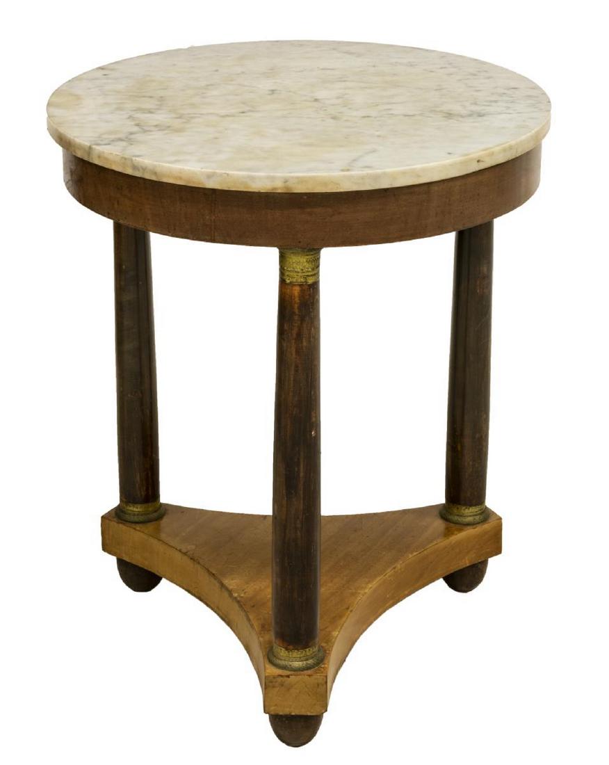 FRENCH EMPIRE STYLE MARBLE-TOP GUERIDON TABLE: French Empire style gueridon table, early 20th c., the circular marble top, over a pedestal base, with gilt metal accents, rising on cupped feet, approx 28"h, 23.5"diam Start Price: $200.00