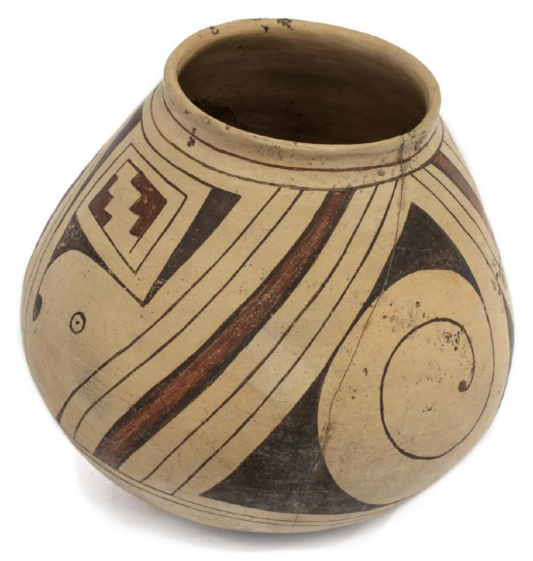 CASAS GRANDES POLYCHROMED EARTHENWARE VESSEL: Casas Grandes polychromed earthenware vessel, retaining hand written tag with date of 1050-1340AD, intact with hairline running from rim to base, approx 10"h, 11"w, 3lbs **Provenance: From the Estate 