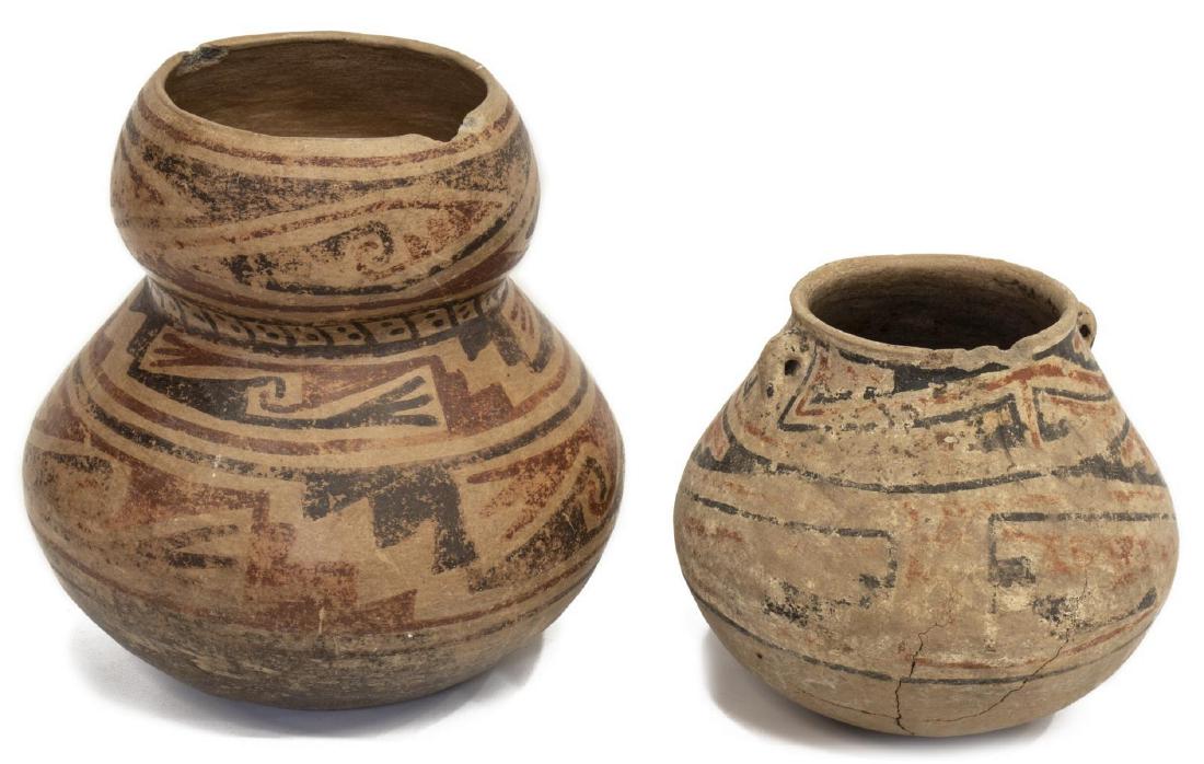 (2) CASAS GRANDES POLYCHROME EARTHENWARE VESSELS: (lot of 2) Casas Grandes polychromed earthenware vessels: (1) shaped pot, retaining hand written tag with date of 1050-1340AD, rim chips, approx 9.25"h, 8.75/9"w: (1) smaller vessel with diminutive sh