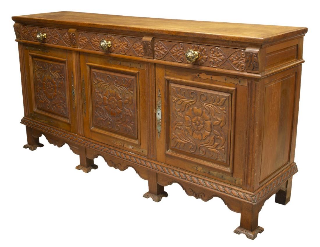 FRENCH RENAISSANCE REVIVAL OAK SIDEBOARD: Renaissance Revival oak sideboard, 20th c., accented with pressed foliate carving, rectangular with three drawers over three doors, rising on shaped platform feet, approx 41"h, 81.5"w, 20.25"d Start P