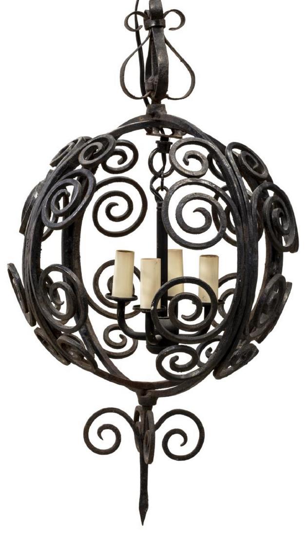 WROUGHT IRON SCROLLED SPHERE PENDANT HANGING LIGHT: Wrought iron hanging light, having spherical shade with scrollwork, concealing four faux candles, ending in spire drop finial, approx 28"h, 13"diam, 11.5lbs Start Price: $100.00