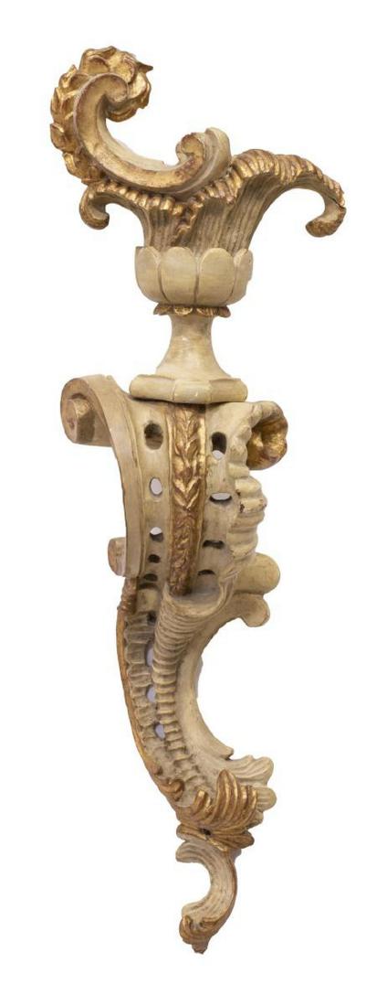 ITALIAN PALLADIO PARCEL GILT CARVED WALL SCONCE: Italian parcel gilt painted and carved architectural candle wall sconce, Palladio, mid 20th c., fashioned in two parts with rocaille and foliate carving throughout, some restoration, finish loss, appr