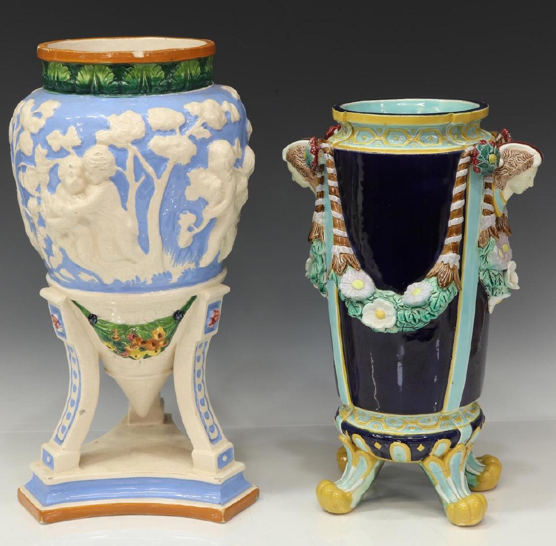 (2) ENGLISH MINTON & ITALIAN MAJOLICA URNS VASES: (lot of 2) Majolica urns, including: (1) English majolica urn/ vase, attributed to Minton, unmarked, with figural mask handles, high relief swags of floral garland, body with dark cobalt glazed field,