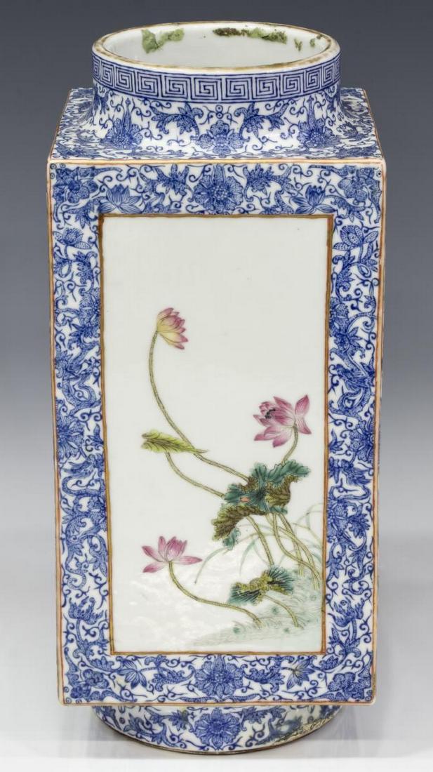 CHINESE PORCELAIN SQUARE VASE ENAMELED FLOWERS: Chinese porcelain square vase, cong form, finely enameled blue floral ground with Greek key border, unique reserves of polychrome enameled floral sprays, rising on circular foot, blue four character m