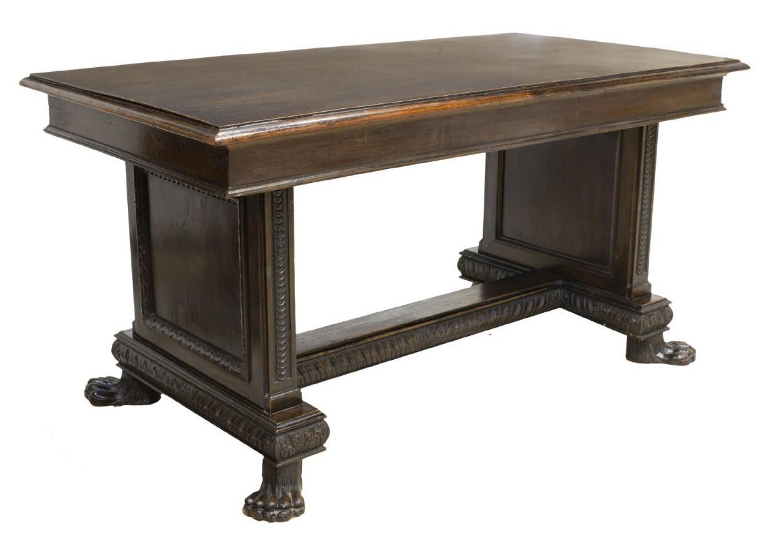 ITALIAN RENAISSANCE REVIVAL WALNUT LIBRARY TABLE: Italian Renaissance Revival walnut library table, 20th c., the rectangular top rising on a carved trestle base, all over paw feet, approx 29"h, 71"w, 35.5"d Start Price: $300.00
