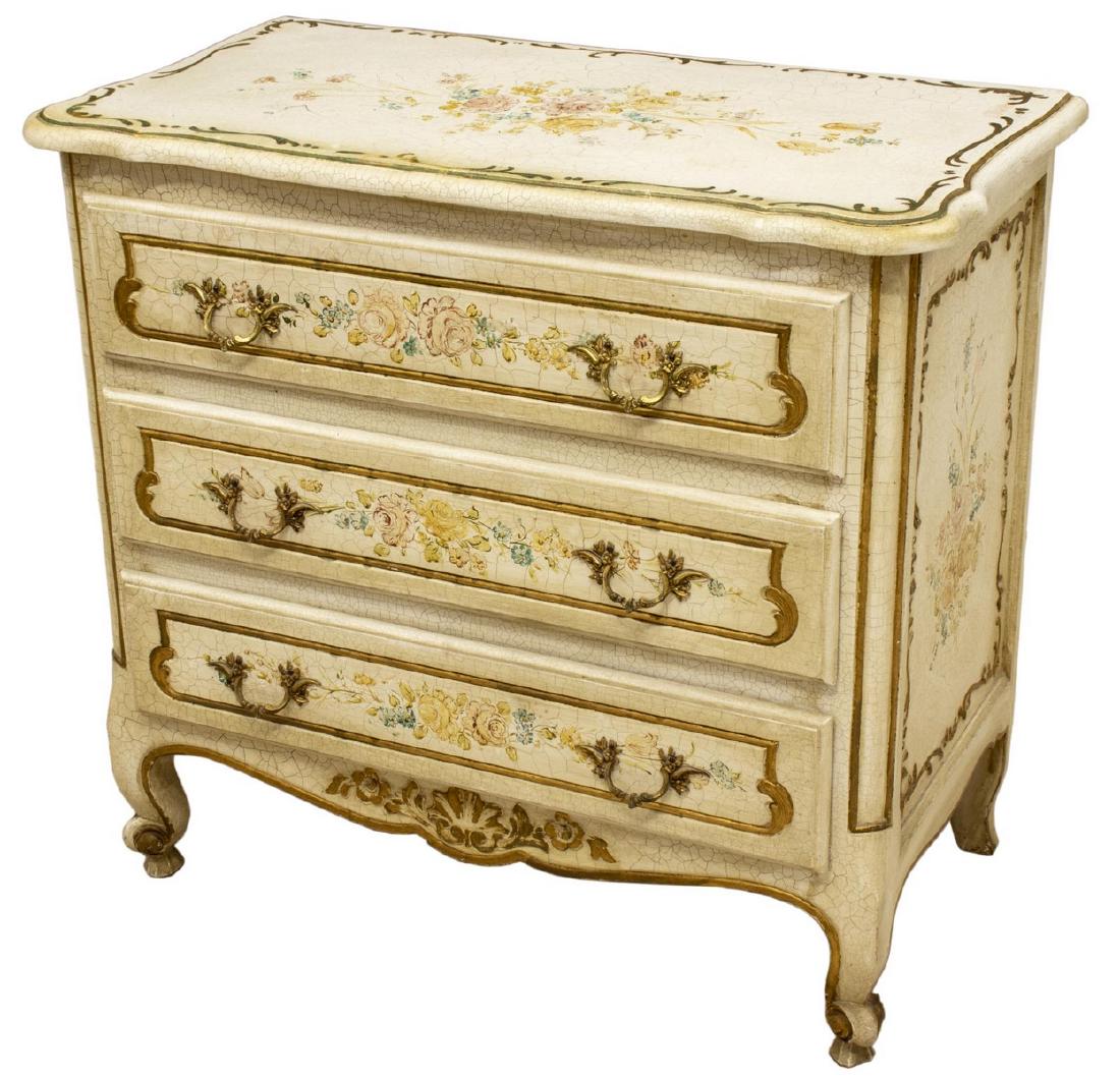 LOUIS XV STYLE PARCEL GILT PAINTED COMMODE: Louis XV style painted commode, 20th c., parcel gilt, with intentional crackle finish, polychrome painted floral sprays, fitted with three drawers, rising on cabriole legs, ending in whorl feet, appro
