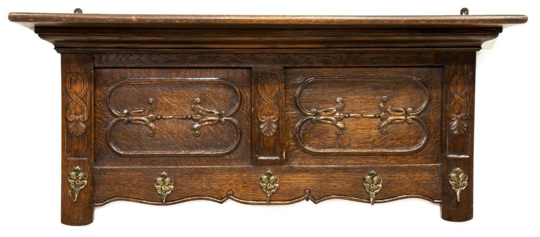 FRENCH OAK FOLIATED WALL-HANGING HALL COAT RACK: French oak hall rack, 20th c., the stepped top above a foliate carved backboard, having five hooks, approx 18.5"h, 45.5"w, 7.5"d Start Price: $80.00