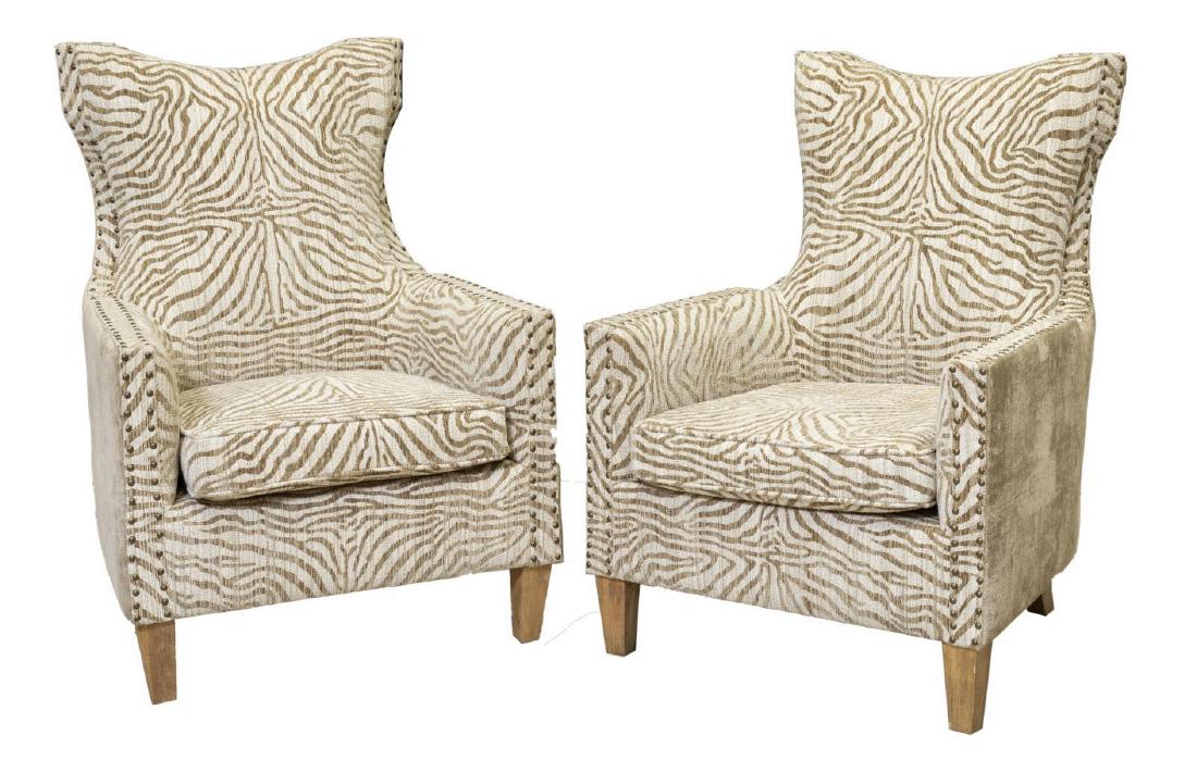 (2) CONTEMPORARY ZEBRA PRINT UPHOLSTERED ARMCHAIRS: (pair) Contemporary armchairs, late 20th c., in zebra patterned upholstery, having slightly rounded back, over squared armrests, padded seat cushion, rising on tapered wood legs, approx 43"h, 30"w, 30