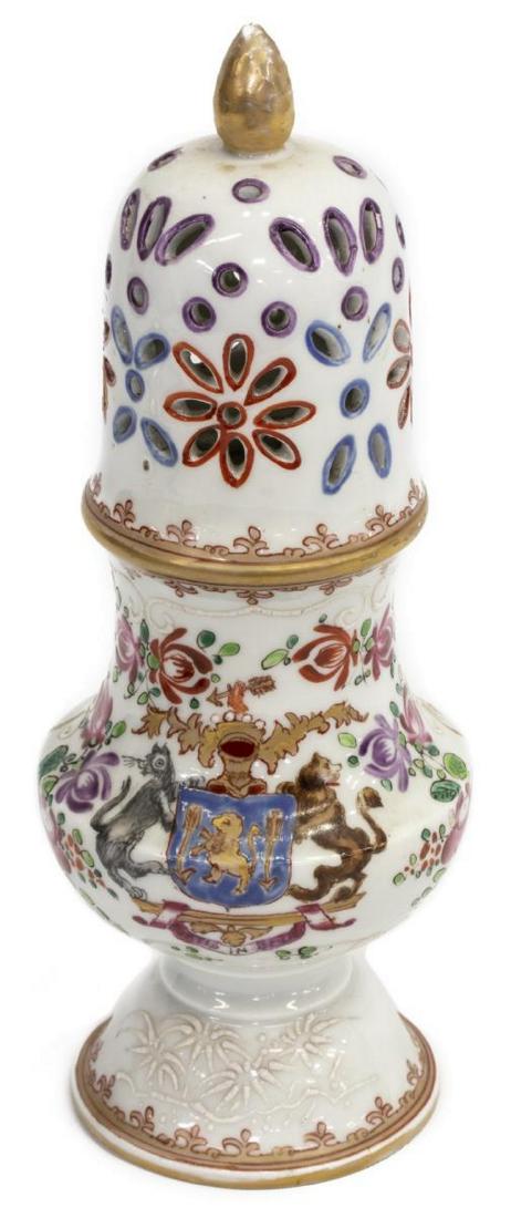 SAMSON OF PARIS ARMORIAL PORCELAIN SUGAR CASTER: Samson of Paris porcelain sugar caster/ muffineer, late 19th c., in the style of Chinese Export armorial wares, gilt acorn finial, over pierced dome, raised enamel cartouche centering heraldic coat of