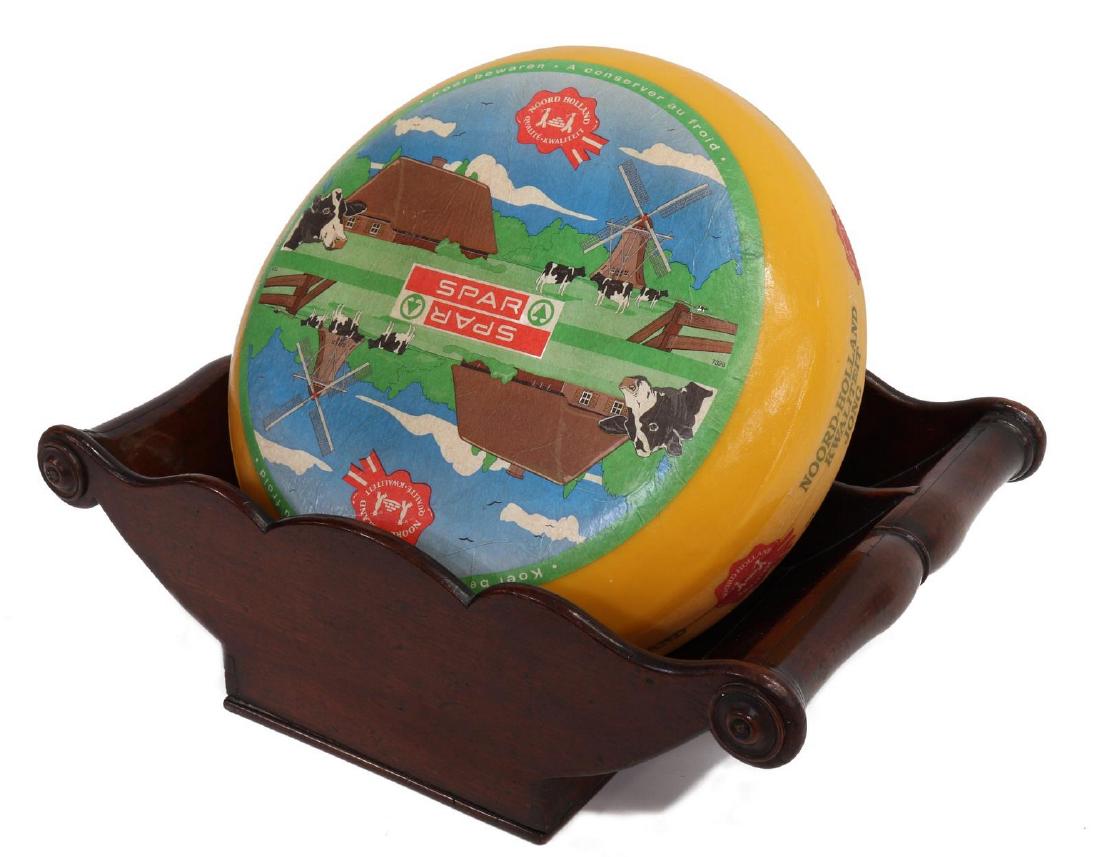 ENGLISH GEORGIAN MAHOGANY CHEESE CRADLE COASTER: English Georgian mahogany double cheese cradle/ coaster, 19th c., having bolster turned ends with applied bosses, two interior sections, on plinth base, lacking one applied boss, approx 5.75"h, 18"l,