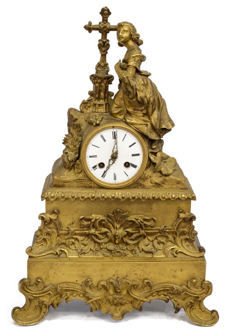 FRENCH GILT METAL RELIGIOUS FIGURAL MANTEL CLOCK: French gilt metal mantel clock, late 19th c., with cast figure of a courtly maiden kneeling at Gothic style cross, over white enamel dial with black roman numerals, housing unmarked time and strike mo