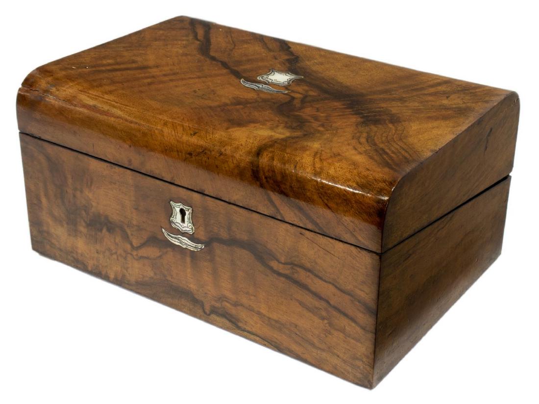 ENGLISH BURLED WALNUT TRAVELING LAP DESK: English burled walnut traveling lap desk, 19thc., having engraved mother-of-pearl cartouche and escutcheon, fitted interior with embossed and lined writing surface, cubbies and pen storage, some wear,