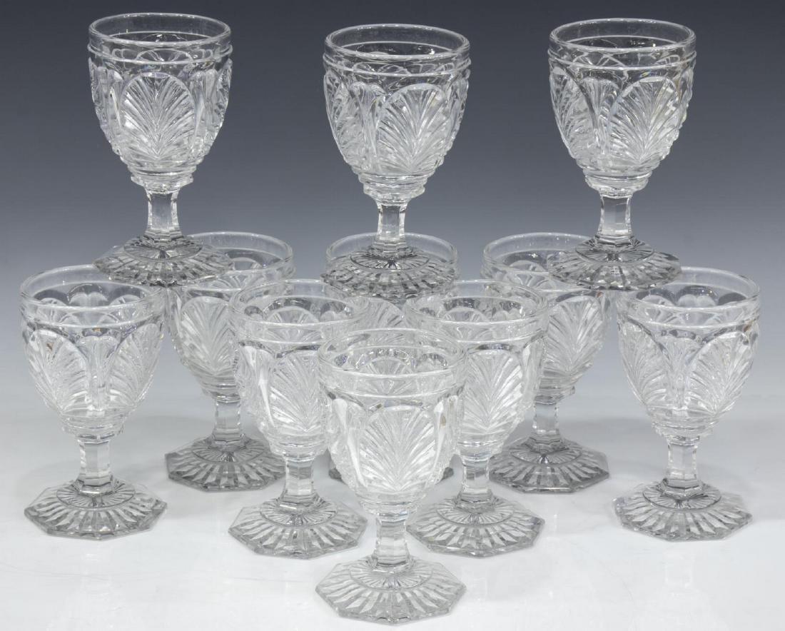 (11) BACCARAT COLORLESS CRYSTAL WINE GLASSES: (lot of 11) Baccarat colorless crystal wine glasses, in a shell pattern, five unmarked, one with chip to the base, approx 5"h, 3"diam; 8.75lbs total Start Price: $150.00