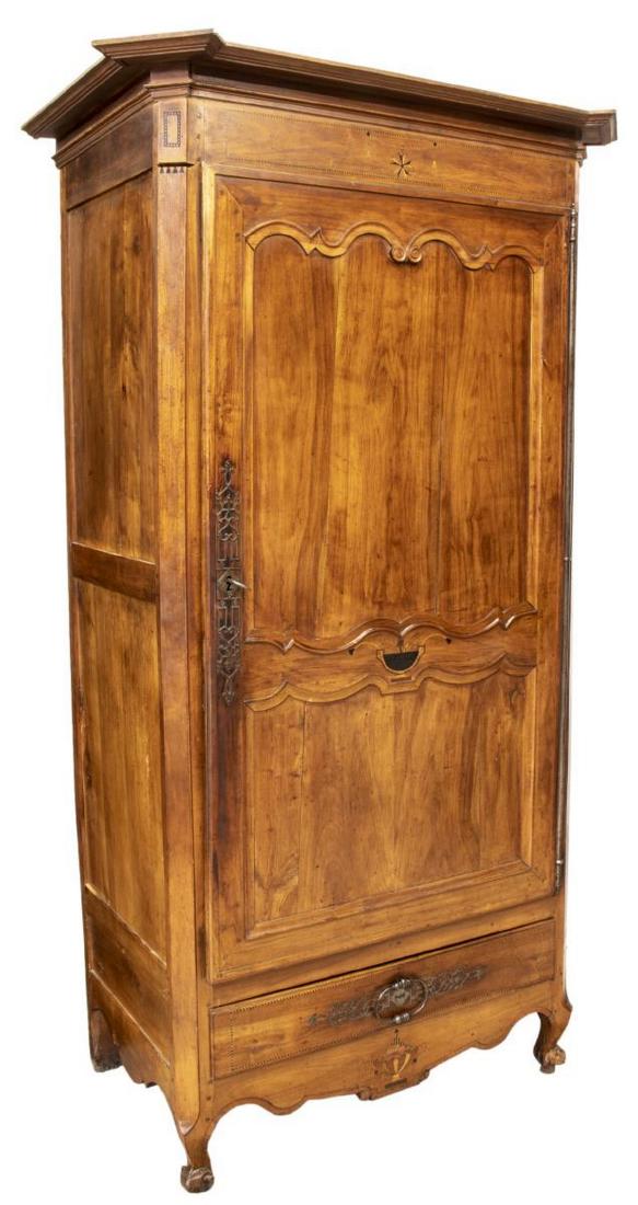 FRENCH LOUIS XV STYLE WALNUT BONNETIERE: French Louis XV style walnut bonnetiere, 19th c., having inlaid accents, a protruding cornice over the single door hung on long exposed hinges, a lower drawer, rising on short scroll foot supports, ap