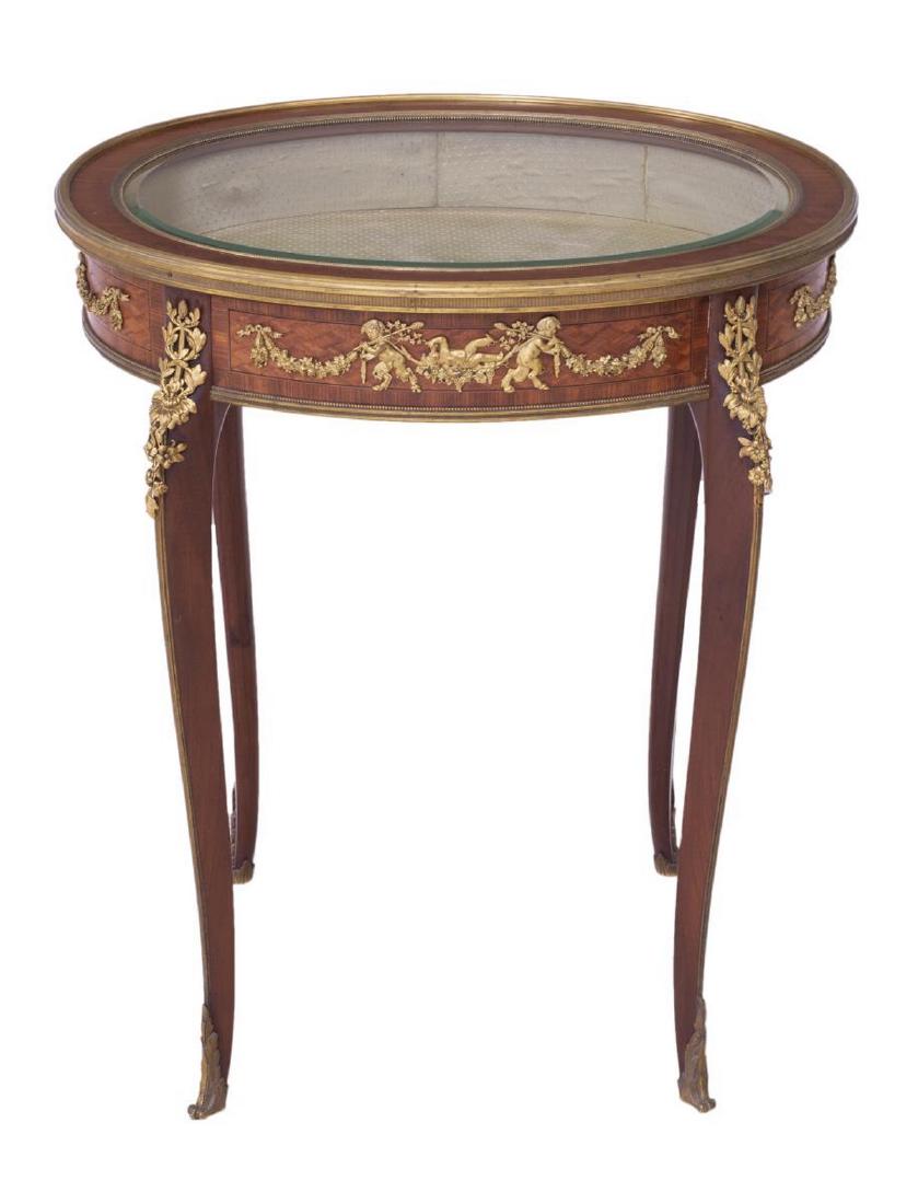 FRENCH LOUIS XV STYLE TABLE TOP VITRINE: French Louis XV style table top vitrine, 20th c., accented with brass ormolu, the wood framed oval beveled glass top over the fabric lined display interior, all rising on cabriole legs, 29.5"h, 24.5"w