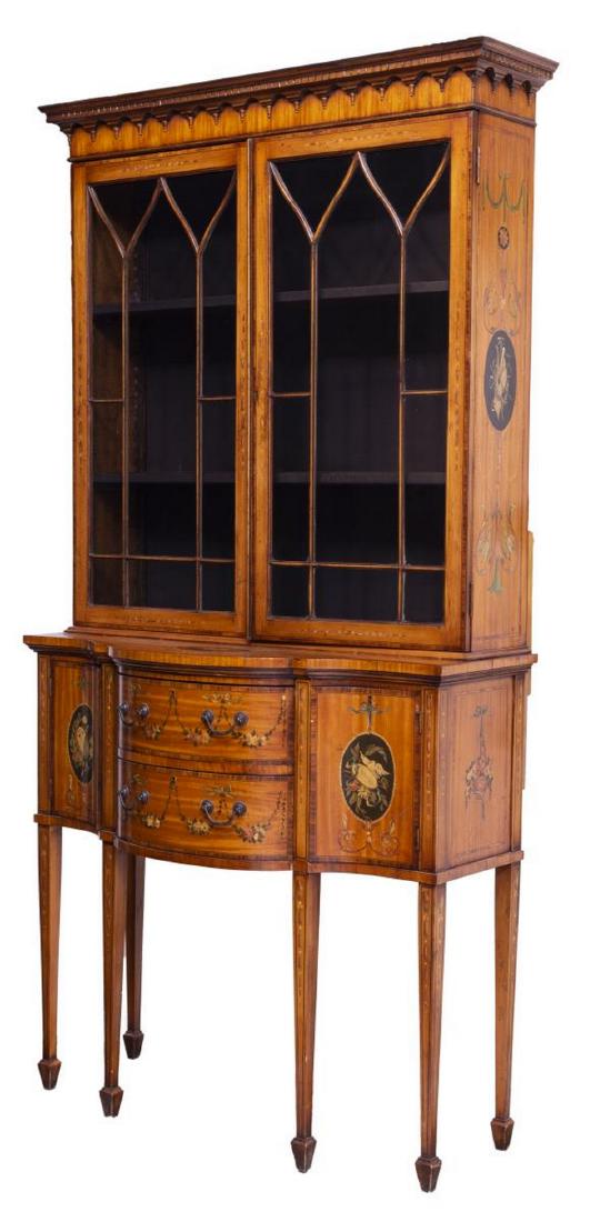 HEPPLEWHITE STYLE MAHOGANY FLORAL ACCENTED CABINET: Hepplewhite style mahogany cabinet accented with floral and scroll painting, 19th c., the protruding cornice over two multi pane glazed doors opening to the fabric lined interior with adjustable heigh
